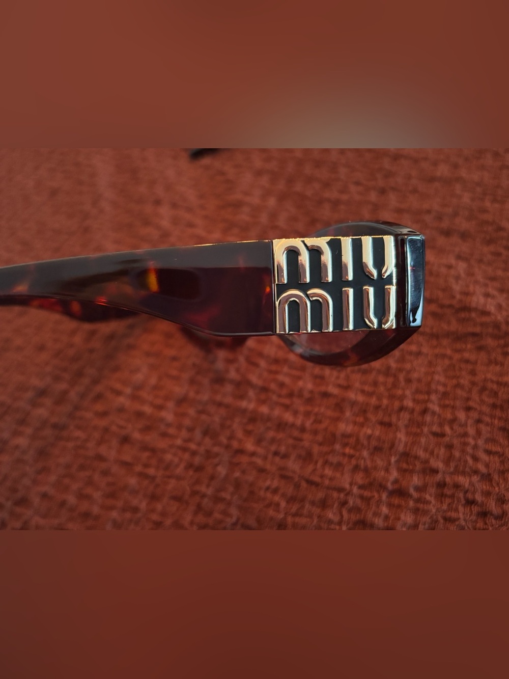 Miu Miu Tortoiseshell Sunglasses with Gold Logo Accent